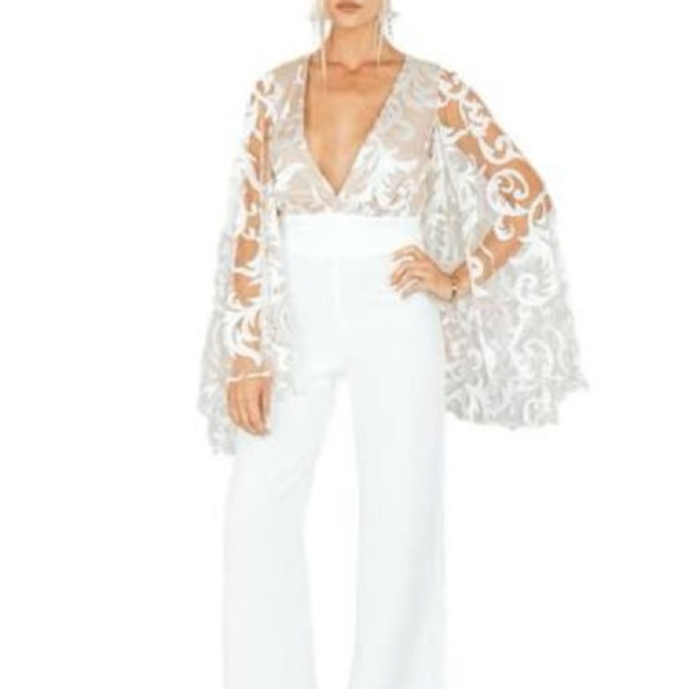 L’Abeye White Galaxy Jumpsuit ft. on Naomi Southern Charm. Small/ 4